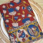Rust Kalamkari Handloom Saree With Floral & Folk Art Motifs